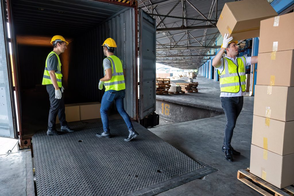 Workers unloading a container