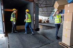 Workers unloading a container